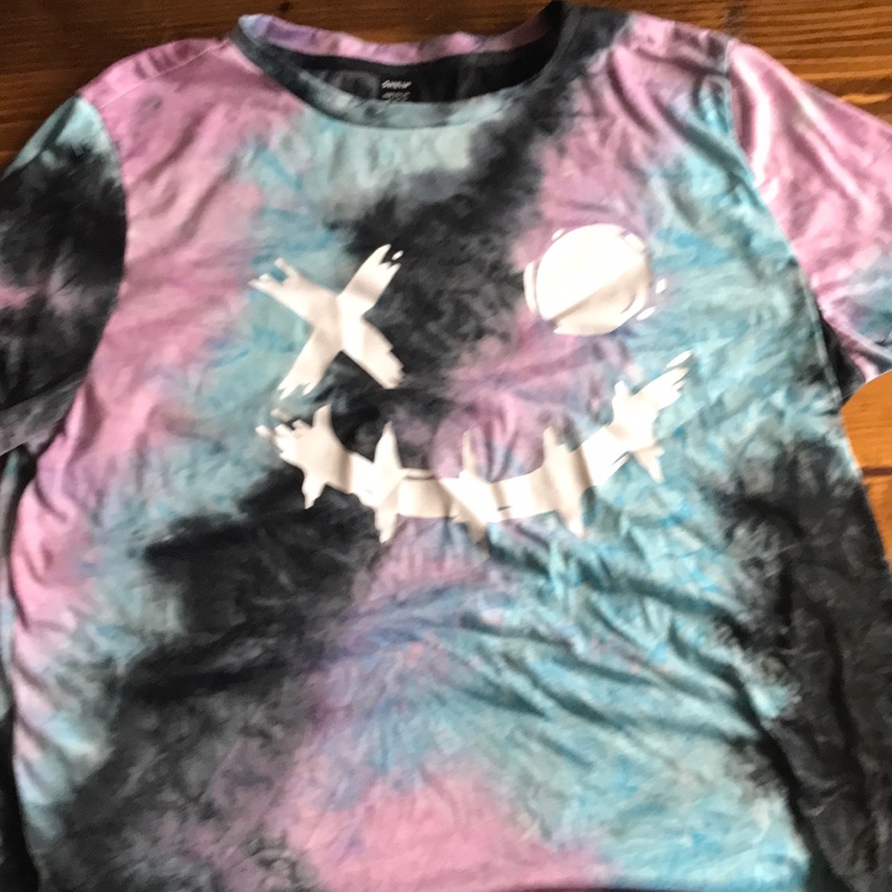 tie dye top with a purge face over it
